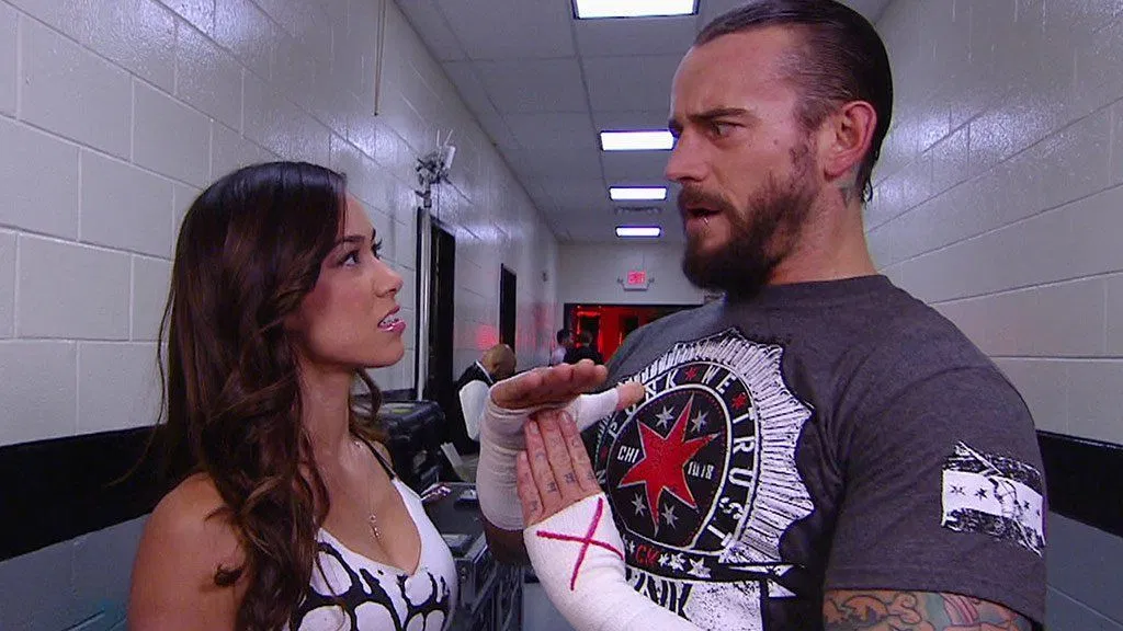 AJ Lee Reacts After CM Punk Is Attacked by Female WWE Superstar
